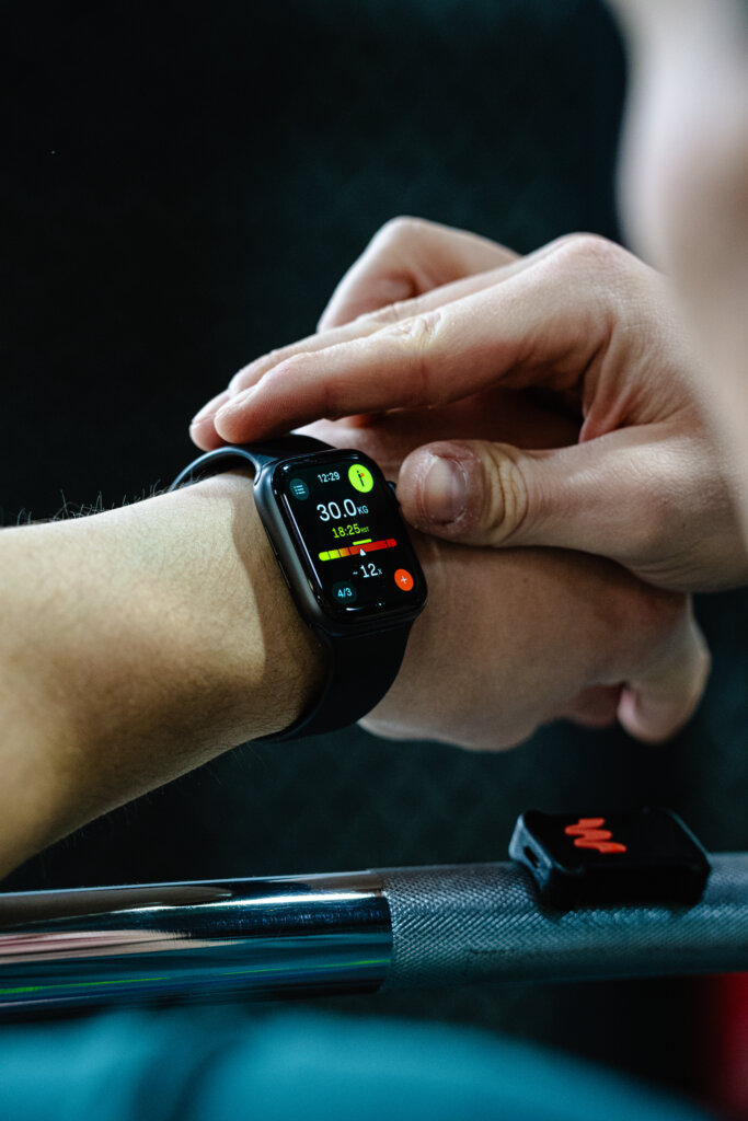 Athlete checking Enode app on Apple Watch